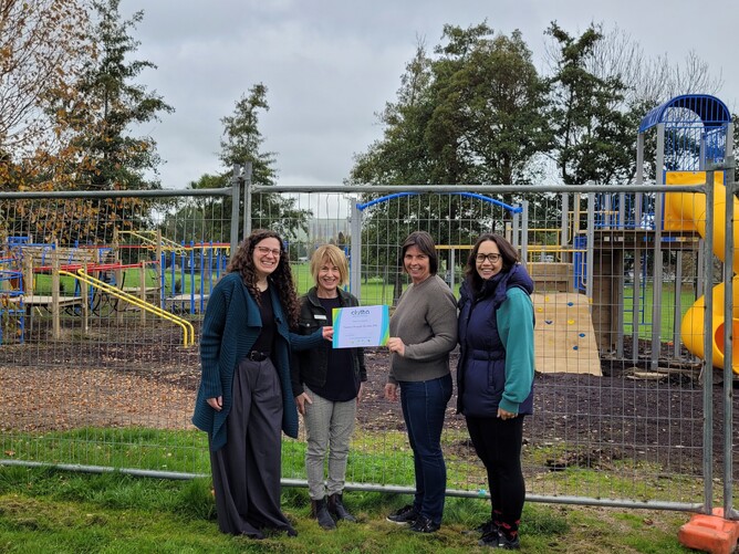 Jess Weichler and Fiona Hancox present certificate to Tapanui Primary PTA Chair Vanessa Stewart and Treasurer Joy Campbell.