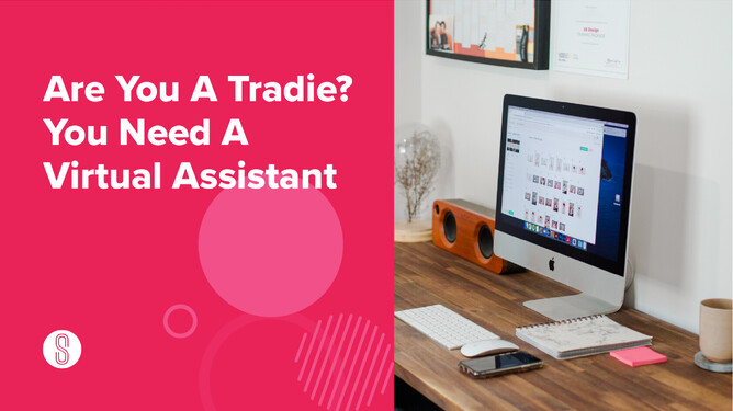 A desktop workspace with a computer showing images, a notebook, pens, a phone, and a coffee mug on a wooden table, with the text 'Are You A Tradie? You Need A Virtual Assistant' on the left