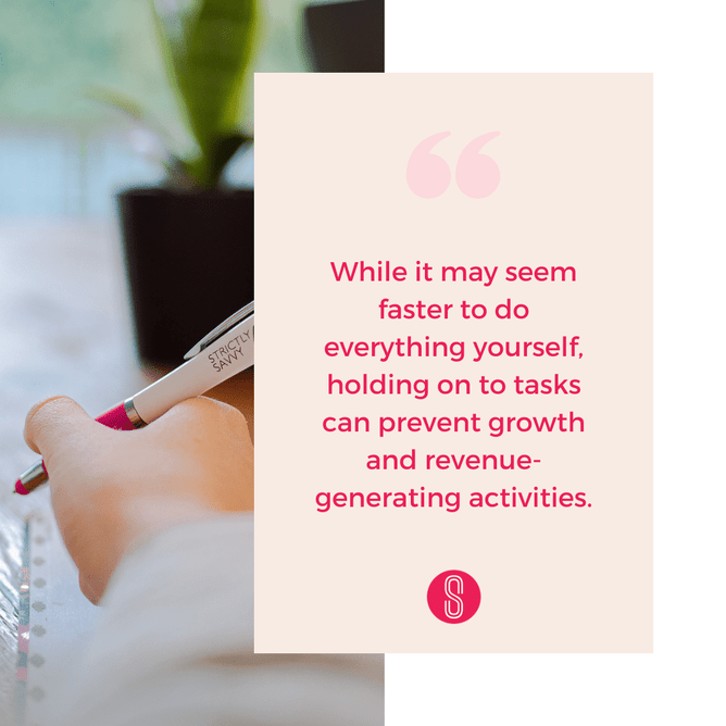 Close-up of a hand holding a pen with a blurred background, and a quote in a soft pink box reading 'While it may seem faster to do everything yourself, holding on to tasks can prevent growth and revenue-generating activities'
