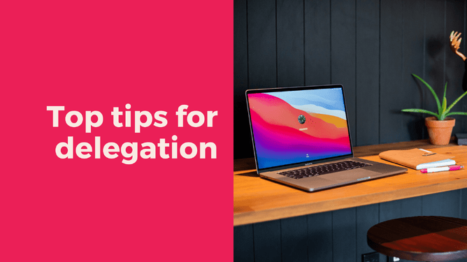 Pink graphic with the text 'Top tips for delegation' alongside a laptop screen displaying a colourful background on a wooden desk, a notebook, and pens