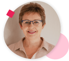 Portrait of a woman with short brown hair and glasses, wearing a beige shirt, smiling, framed by a pink circle with geometric accents