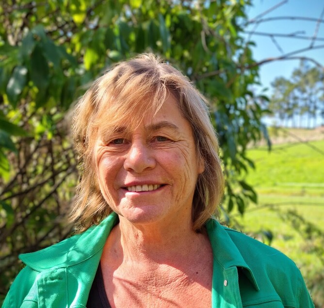 Woman smiling at the camera.