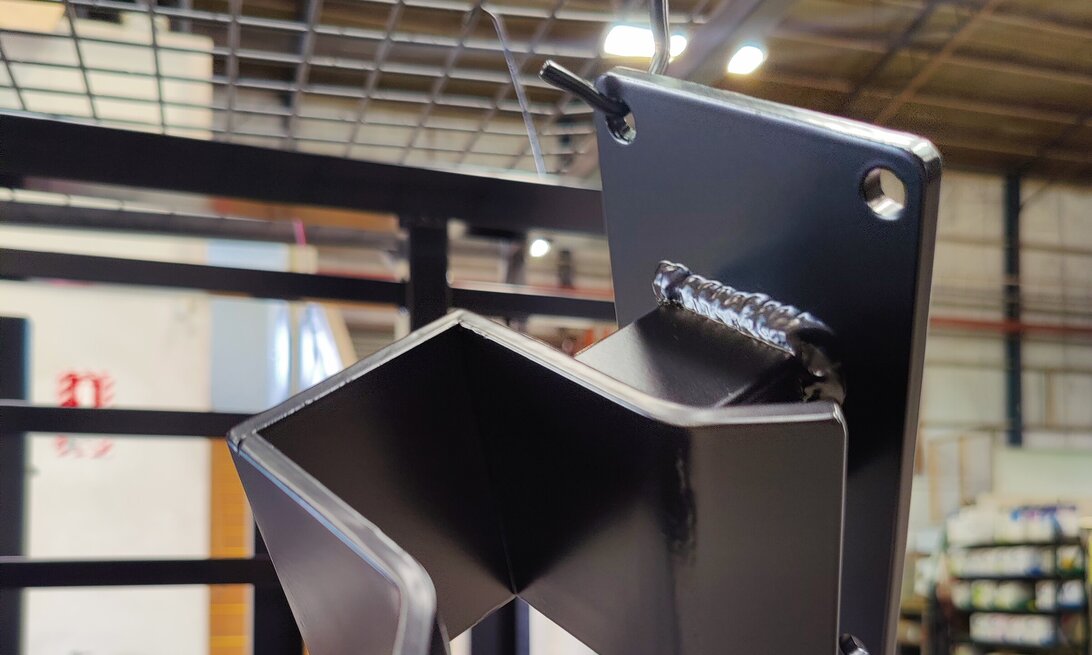 Photo of an automatic gate latch powder coated in gloss back by Hamilton Industrial Powder Coating