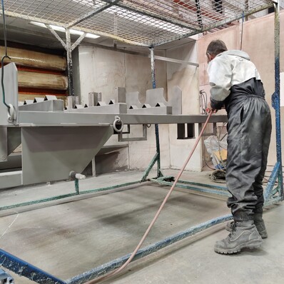 Photo of Hamilton Industrial Powdercoating team member zinc priming steel