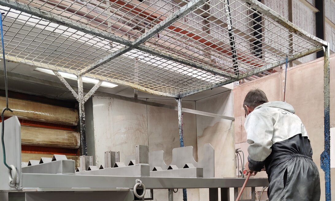 Photo of Hamilton Industrial Powdercoating team member zinc priming steel