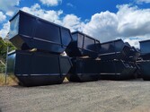 Photo of 12 out of 20 black powder coated skip bins
