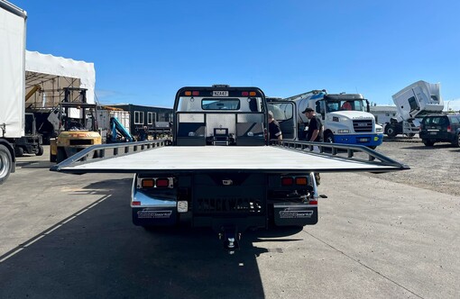 Rear view of Fuso Canter Salvage truck with custom fabricated slide deck