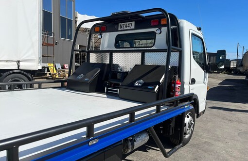 Photo of fuso canter salvage truck with custom fabricated tool box and slide deck- rear drivers side view