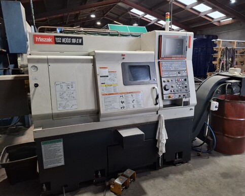 Mazak Quick Turn II lathe with control panel in an industrial machine shop.