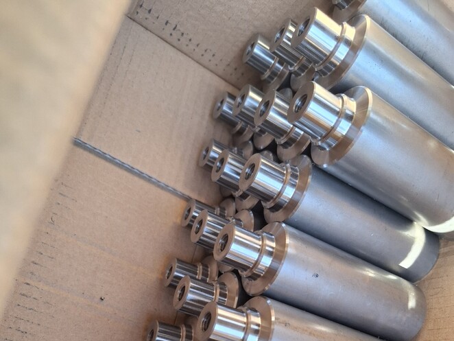 Close-up of machined aluminium component with sharp internal corners and stepped features.