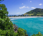 Mount Maunganui in background with beach and ocean in foreground