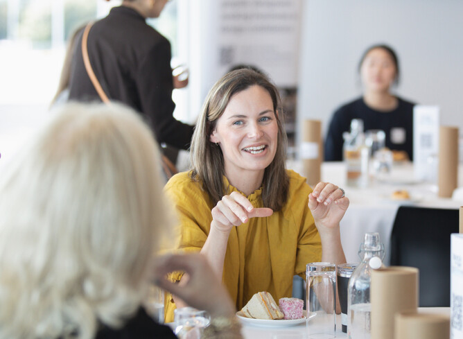 Photo showing designers talking at an event