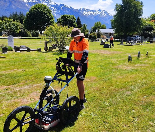 Scientist surveying cemetery