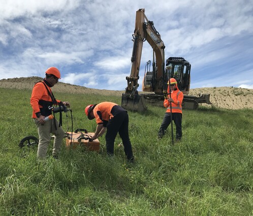 3 Scientists Investigating Landfill