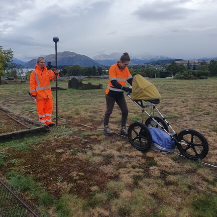 Two female Scientist surveying cemetery