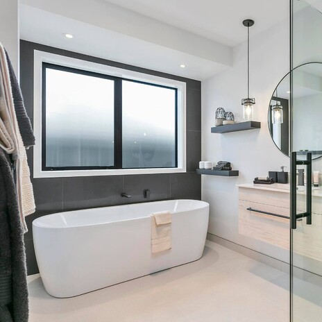 Image of modern tiled bathroom. Tiling service by Cosmic Tiling for A1 Homes. Waikato.