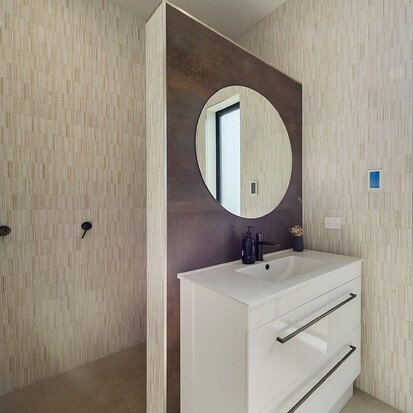 Image of modern tiled bathroom and walk in shower. Tiling service by Cosmic Tiling for Waikato Build. Waikato.