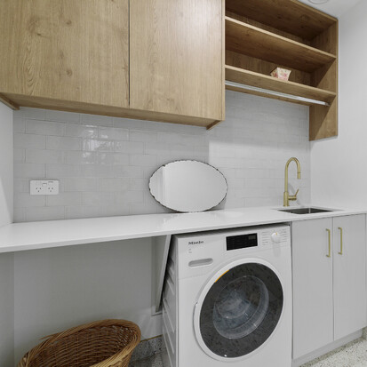 Image of modern tiled laundry. Tiling service by Cosmic Tiling for Iconic Construction. Waikato.