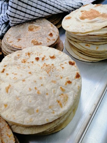 a stack of Taco Addicts tortillas, ready to be packaged up for Moore Wilsons