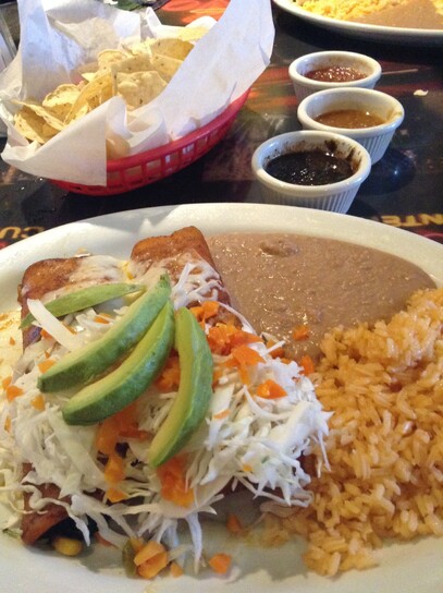 an enchilada plate with rice, beans & avocado!