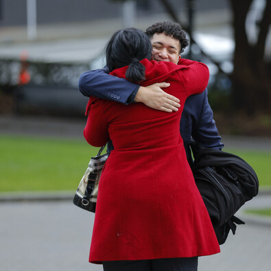 Image of two Ngāti Ruapani members hugging at AIP