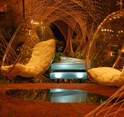 Ben Hoyle Design exhibition landscape at the 2008 Singapore Garden Festival featuring hanging acrylic chairs hovering over floating deck over