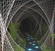 A blue water-filled path links through artfully woven wool panels.