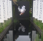 The image of a dove is hidden across many turning cogs. Once these all align the image is revealed. Peace comes from many actions.