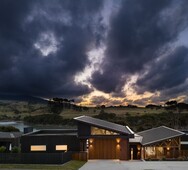 Rangitahi Peninsula house exterior at sunset