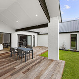 Spacious deck opening from living room &mdash; seamless indoor-outdoor flow, Nixon Homes