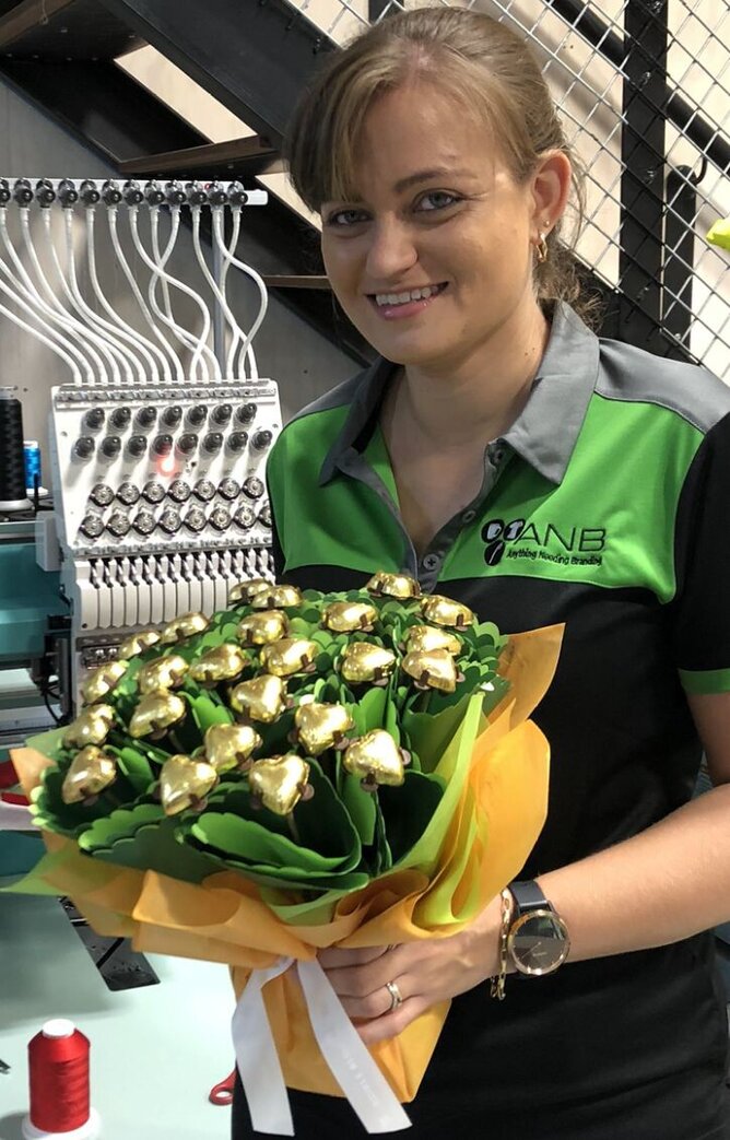 Winner Ashley Waldmeyer from ANB Embroidery & Promotional Solutions Ltd, with her beautiful bouquet of chocolate flowers from Edible Blooms!