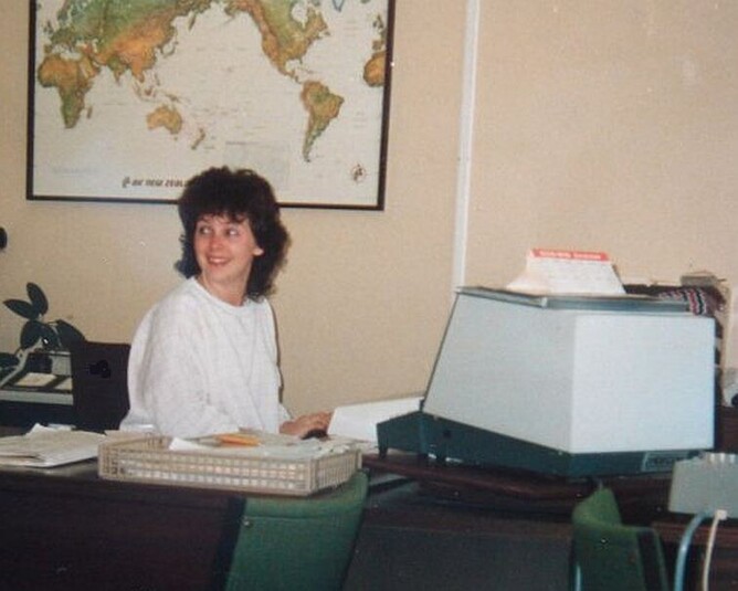 Yes, that's me as a travel agent, sitting at my desk back in 1986. (Check out my computer!)