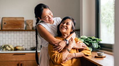 Father having fun teaching his son to ride a bike