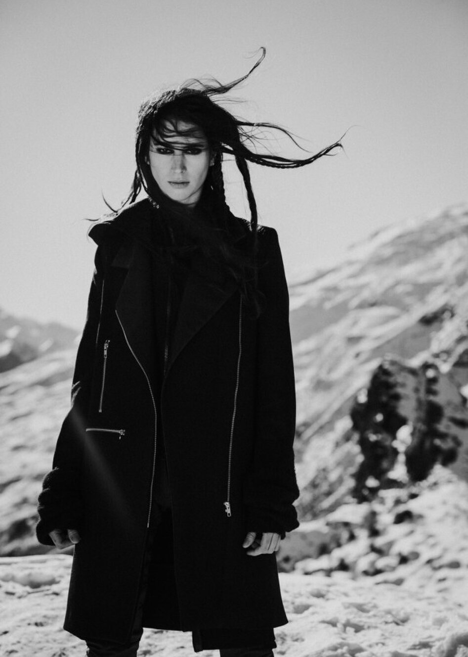 A model in a black Jane Sutherland coat photographed on Coronet Peak Queenstown.