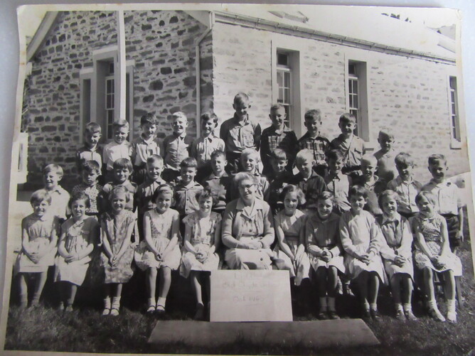 Last photo of the old Clyde School, 1960 before the new school was built. The teacher is Mrs (Ma) Skeene, a lovely lady.  I’m third from the right in the second row.  Note the lack of girls!