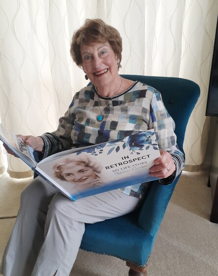 Diane Comber with her life story book