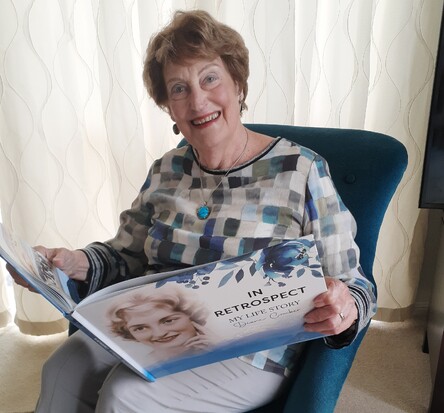 Diane Comber with her life story book