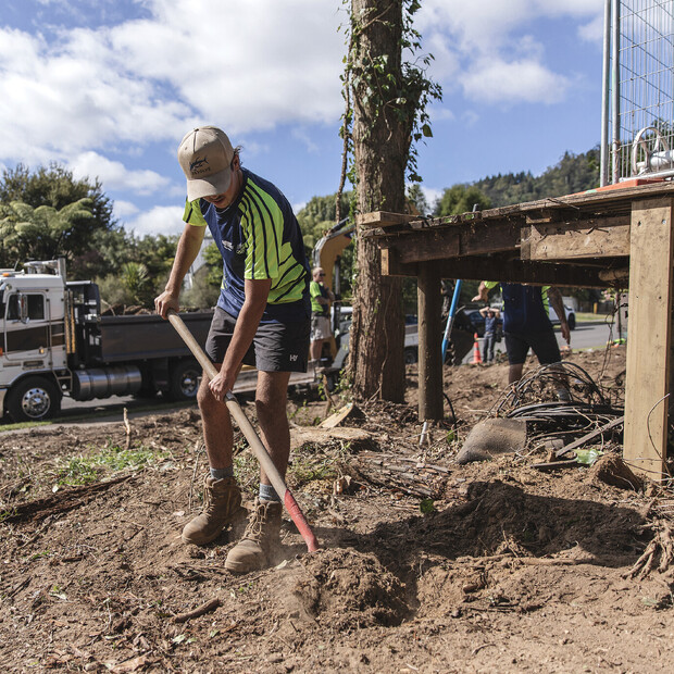 Ultrascape landscape staff member digging on a property in Rotorua