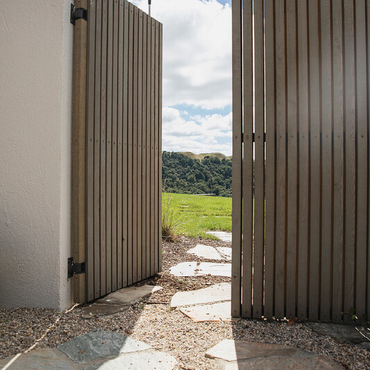 New gate and custom paving at a residential home in Rotorua by Ultrascape Landscaping