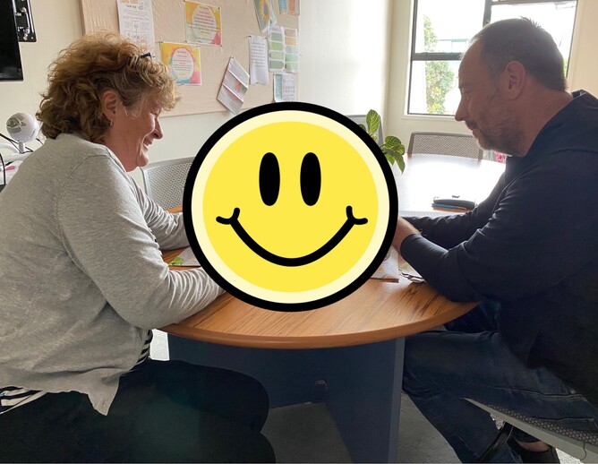 Kate discussing the hot-off-the-press resource prototype with Phillip Norcross of Integral Print.