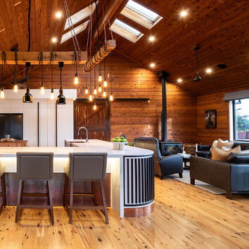 Timber walls and high pitched ceiling with sky light windows. 