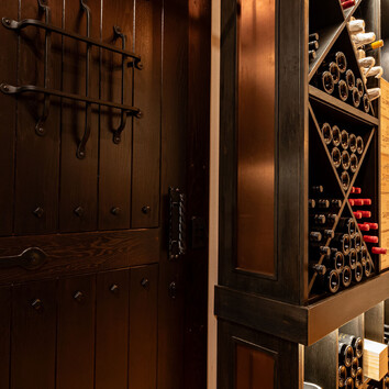 wine cellar with heavy wooden door