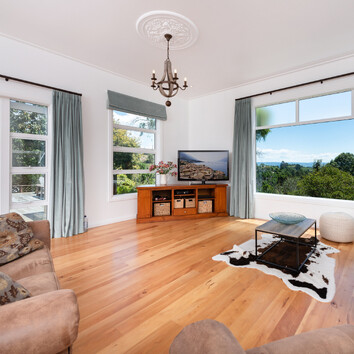 Traditional New Zealand lounge with timber flooring.