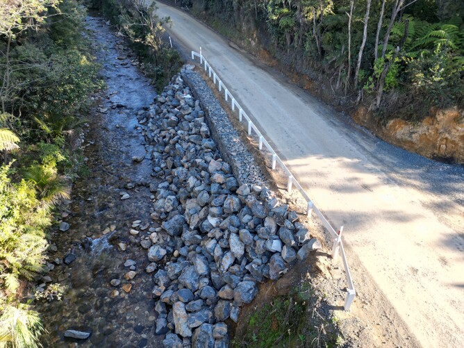 gabion and timber retaining walls with ground anchors, pavement construction, and chipsealing