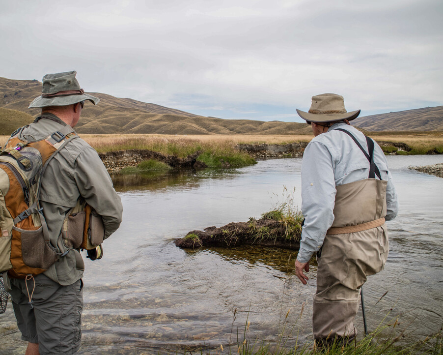New Zealand Fly fishing Guide Stalking a rising Brown in the high country of New Zealand  Todd Adolph