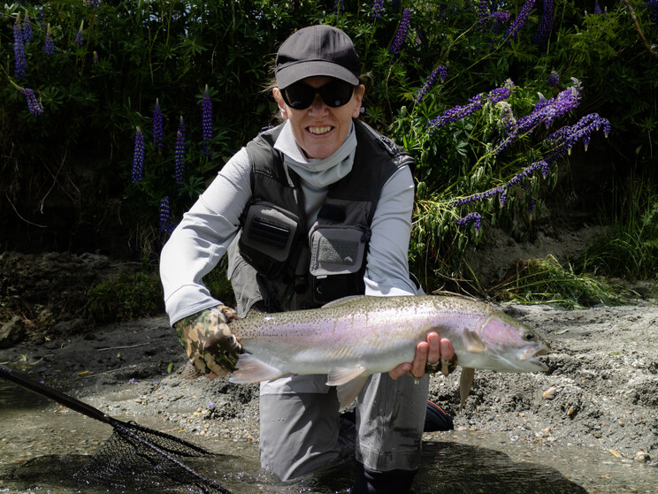 Karen with a well-conditioned wild rainbow trout, from a late spring trip south to the Otago region. Todd Adolph 