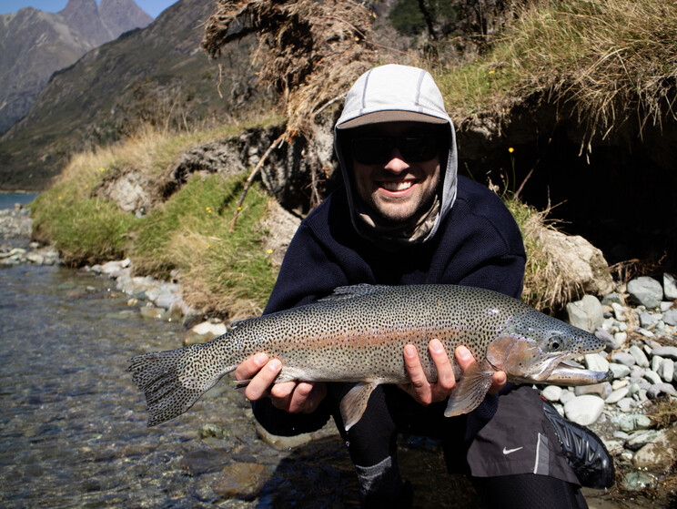 Holden displays a stunningly marked wild rainbow trout from the South Island of New Zealand. Todd Adolph 