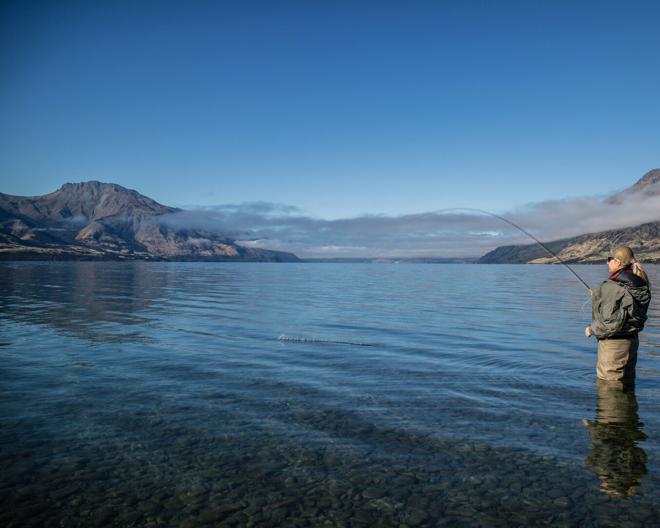 Queenstown Lake edge stalking on Lake Wakatipu. The lake of the sleeping giant  Todd Adolph