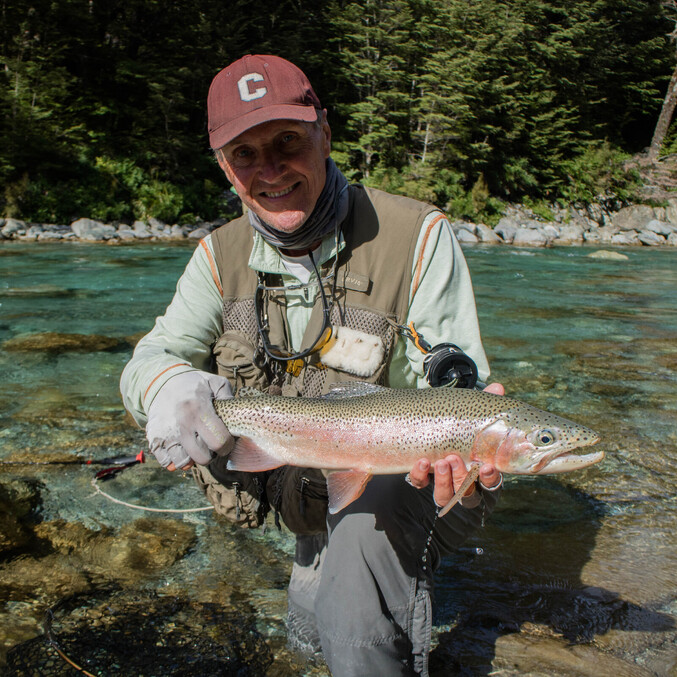 Tom McCabe with a delightful Rainbow trout from the backcountry of New Zealand. Todd Adolph