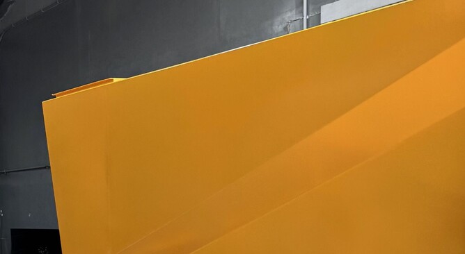 A section of a Crewmix Machine in yellow